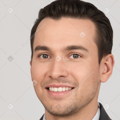 Joyful white young-adult male with short  brown hair and brown eyes