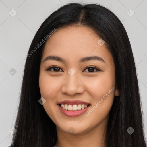 Joyful latino young-adult female with long  brown hair and brown eyes