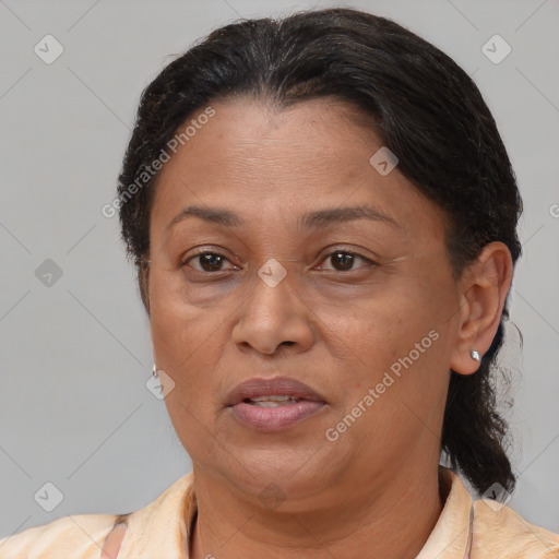 Joyful latino adult female with short  brown hair and brown eyes