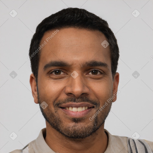 Joyful latino young-adult male with short  black hair and brown eyes