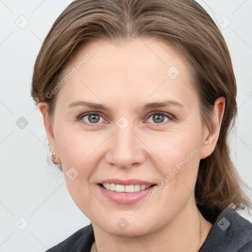 Joyful white young-adult female with medium  brown hair and grey eyes