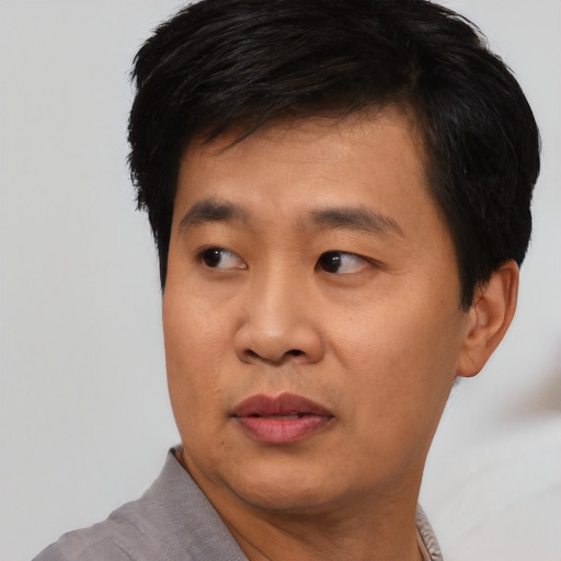 Neutral asian young-adult male with short  black hair and brown eyes