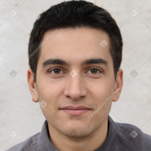 Joyful white young-adult male with short  black hair and brown eyes