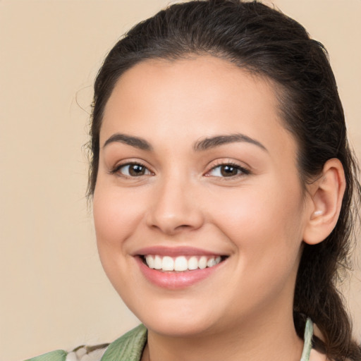 Joyful white young-adult female with medium  brown hair and brown eyes