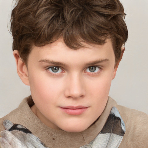 Joyful white child male with short  brown hair and blue eyes