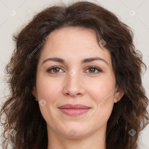 Joyful white adult female with long  brown hair and brown eyes