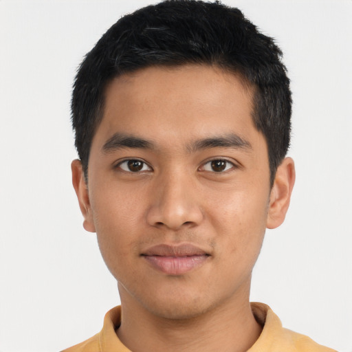 Joyful asian young-adult male with short  black hair and brown eyes