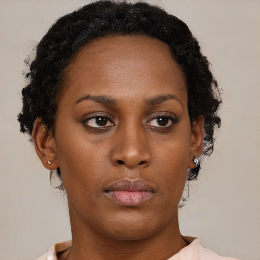 Neutral black young-adult female with short  brown hair and brown eyes