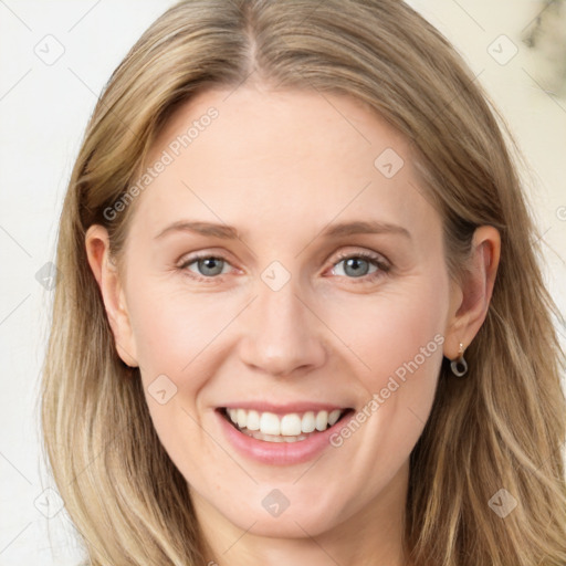 Joyful white young-adult female with long  brown hair and blue eyes