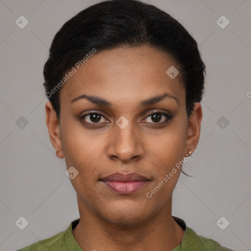 Joyful black young-adult female with short  black hair and brown eyes