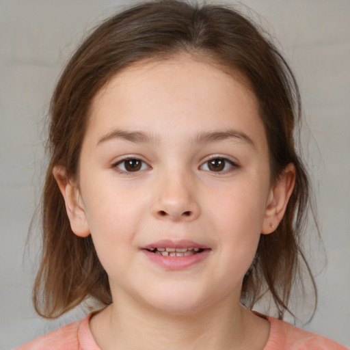 Joyful white child female with medium  brown hair and brown eyes