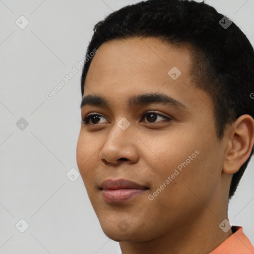 Joyful latino young-adult male with short  black hair and brown eyes