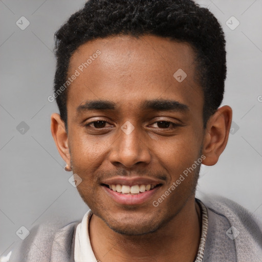 Joyful black young-adult male with short  black hair and brown eyes