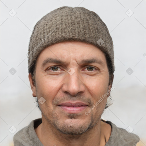 Joyful white adult male with short  black hair and brown eyes