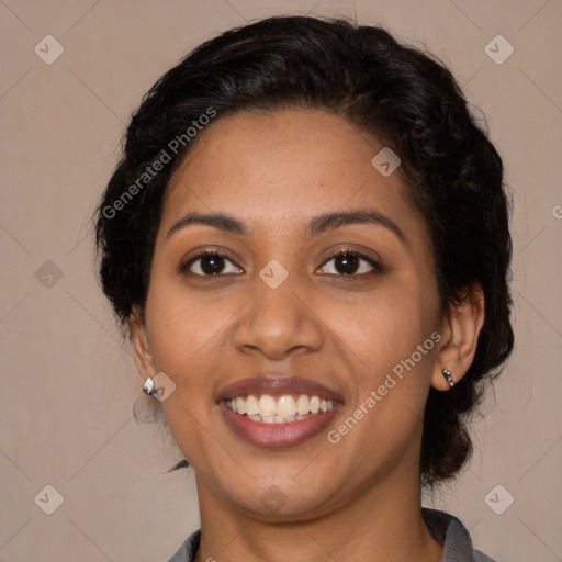 Joyful latino young-adult female with medium  brown hair and brown eyes