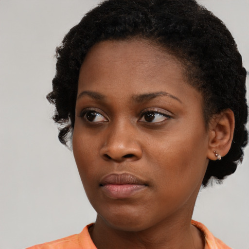 Neutral black young-adult female with short  brown hair and brown eyes