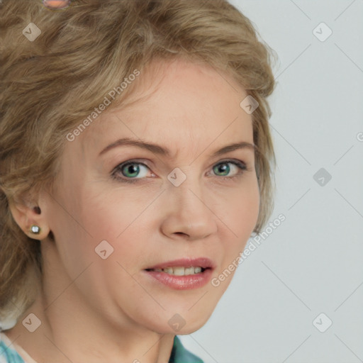 Joyful white young-adult female with medium  brown hair and green eyes