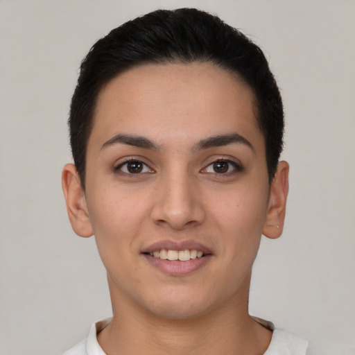 Joyful white young-adult female with short  brown hair and brown eyes