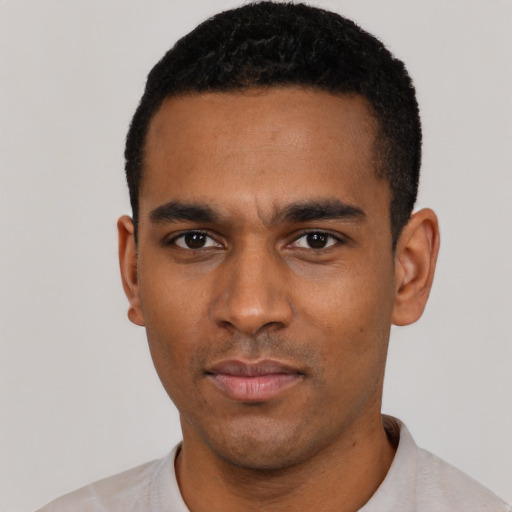 Neutral latino young-adult male with short  black hair and brown eyes