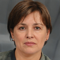 Joyful white adult female with medium  brown hair and grey eyes