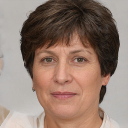 Joyful white middle-aged female with medium  brown hair and brown eyes