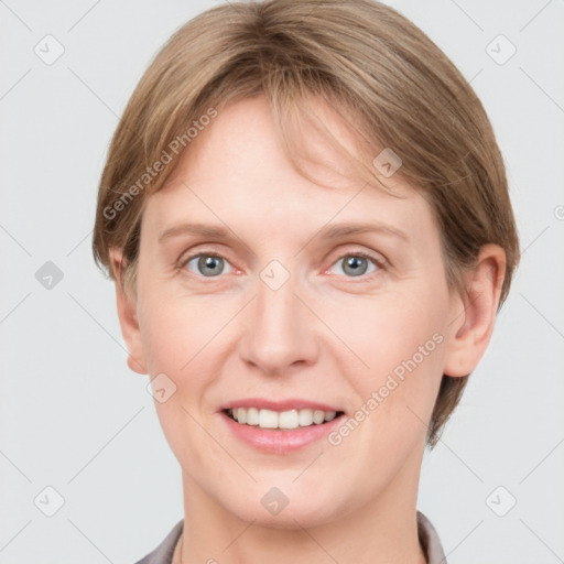 Joyful white young-adult female with short  brown hair and grey eyes