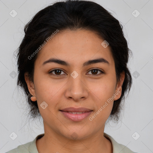 Joyful latino young-adult female with medium  brown hair and brown eyes