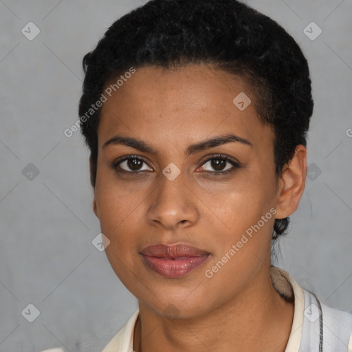 Joyful black young-adult female with short  black hair and brown eyes