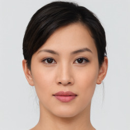 Neutral asian young-adult female with medium  brown hair and brown eyes