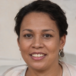 Joyful white adult female with short  brown hair and brown eyes