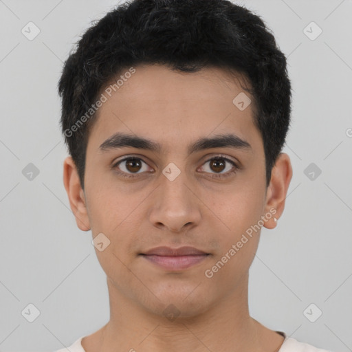 Joyful latino young-adult male with short  brown hair and brown eyes