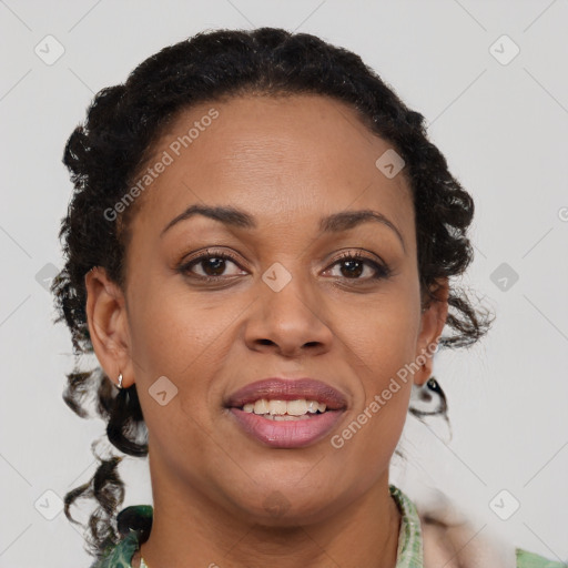 Joyful black adult female with medium  brown hair and brown eyes