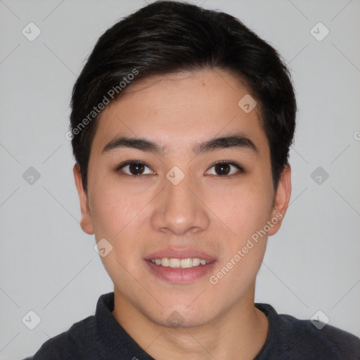 Joyful asian young-adult male with short  black hair and brown eyes