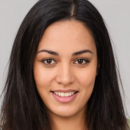 Joyful asian young-adult female with long  brown hair and brown eyes