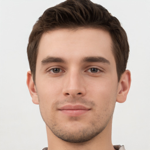 Neutral white young-adult male with short  brown hair and brown eyes