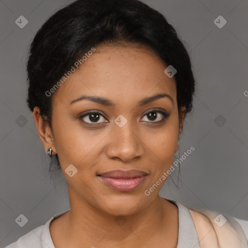 Joyful black young-adult female with short  black hair and brown eyes