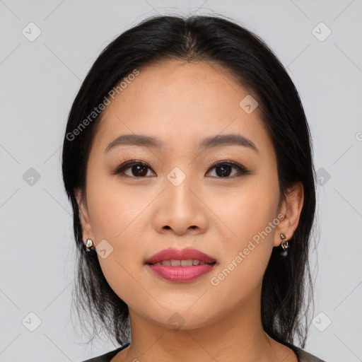 Joyful asian young-adult female with medium  black hair and brown eyes