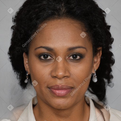 Joyful black adult female with medium  brown hair and brown eyes