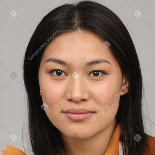 Joyful latino young-adult female with long  brown hair and brown eyes