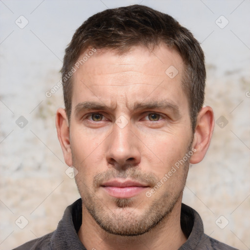 Neutral white adult male with short  brown hair and brown eyes