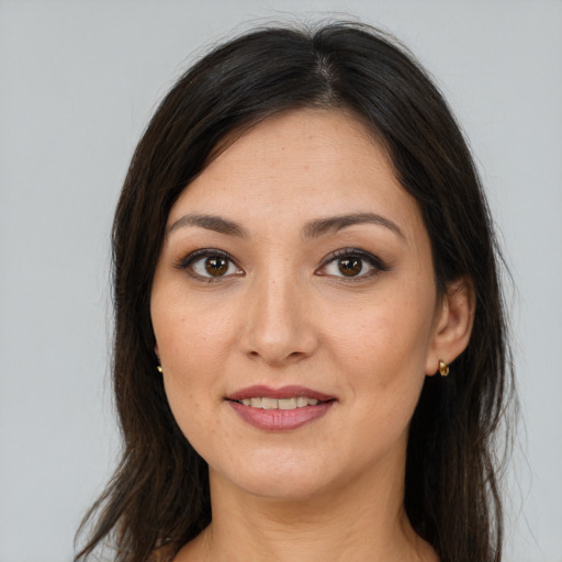 Joyful white young-adult female with long  brown hair and brown eyes