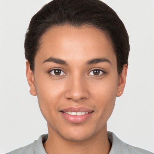 Joyful white young-adult female with short  brown hair and brown eyes