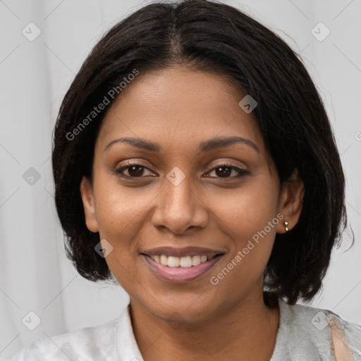 Joyful black young-adult female with medium  brown hair and brown eyes