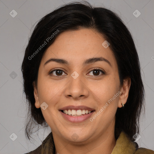 Joyful latino young-adult female with medium  brown hair and brown eyes