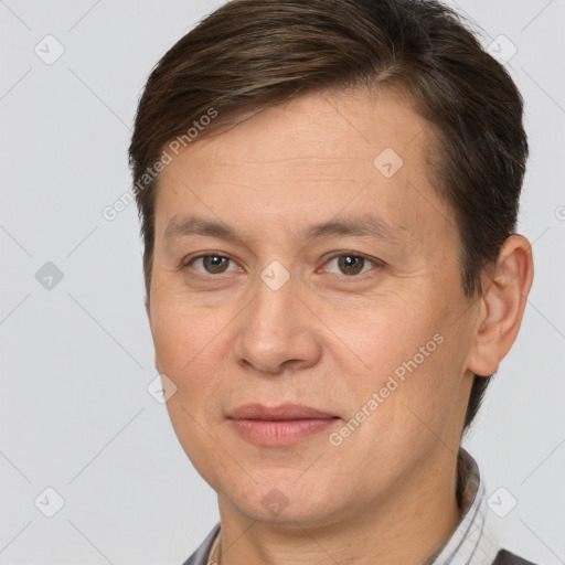 Joyful white adult male with short  brown hair and brown eyes