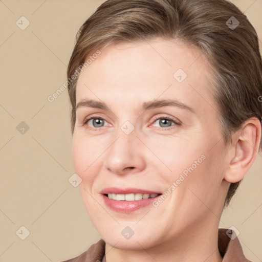 Joyful white young-adult female with medium  brown hair and grey eyes