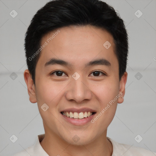 Joyful asian young-adult male with short  brown hair and brown eyes