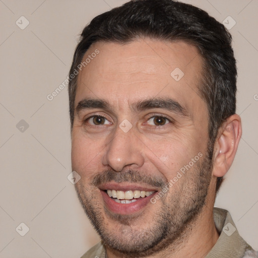 Joyful white adult male with short  brown hair and brown eyes