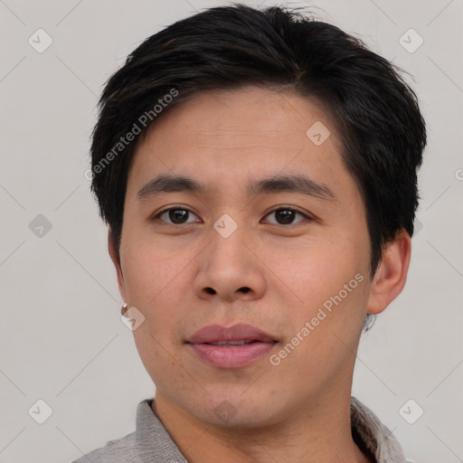 Joyful asian young-adult male with short  brown hair and brown eyes