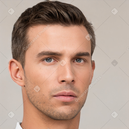 Neutral white young-adult male with short  brown hair and brown eyes